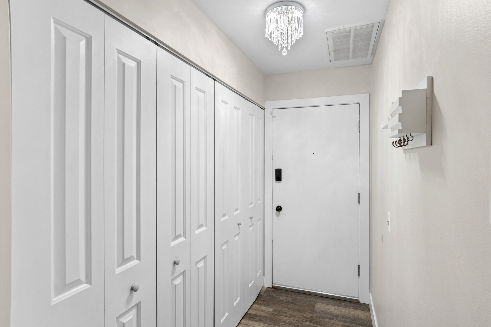 6012 Forest View Road, Unit 1D Lisle, IL 60532 - Photo 4 of 21 a view of a hallway with a chandelier