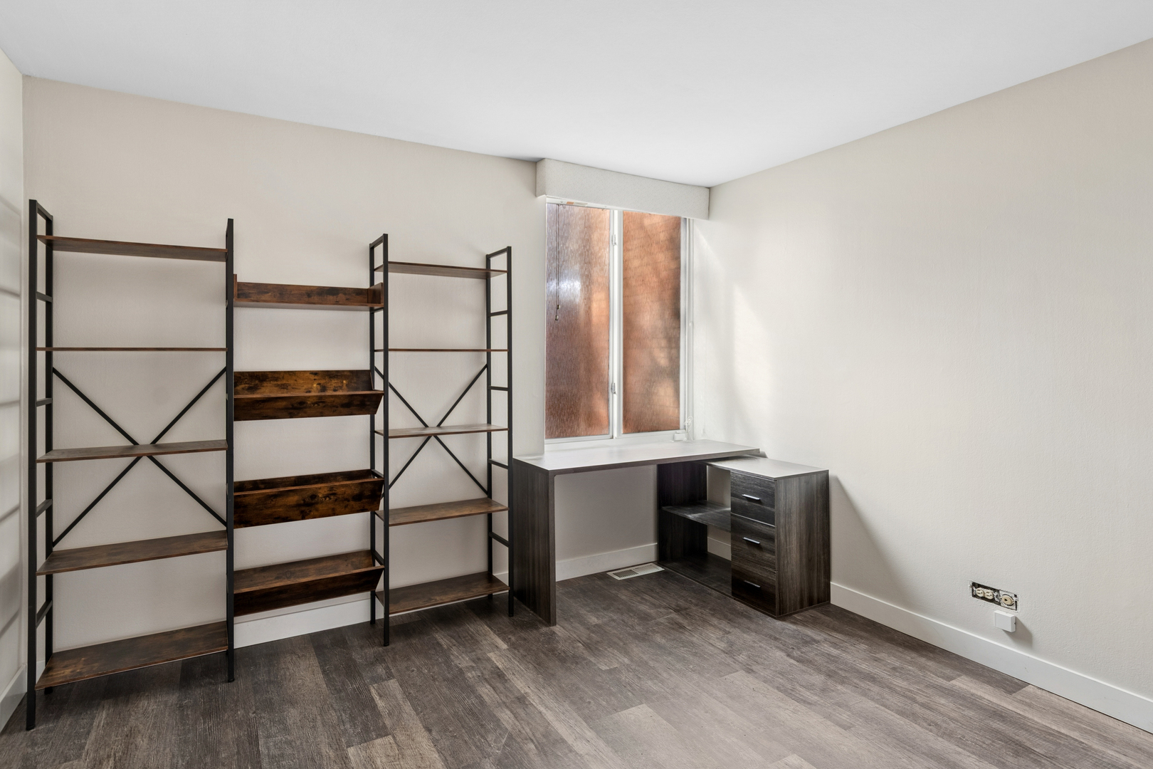 6012 Forest View Road, Unit 1D Lisle, IL 60532 - Photo 5 of 21 a view of an empty room with wooden floor and white walls