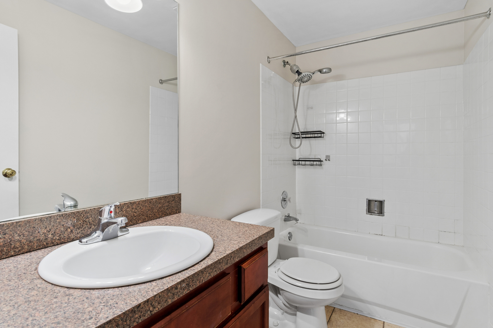 6012 Forest View Road, Unit 1D Lisle, IL 60532 - Photo 7 of 21 a bathroom with a sink a toilet and shower