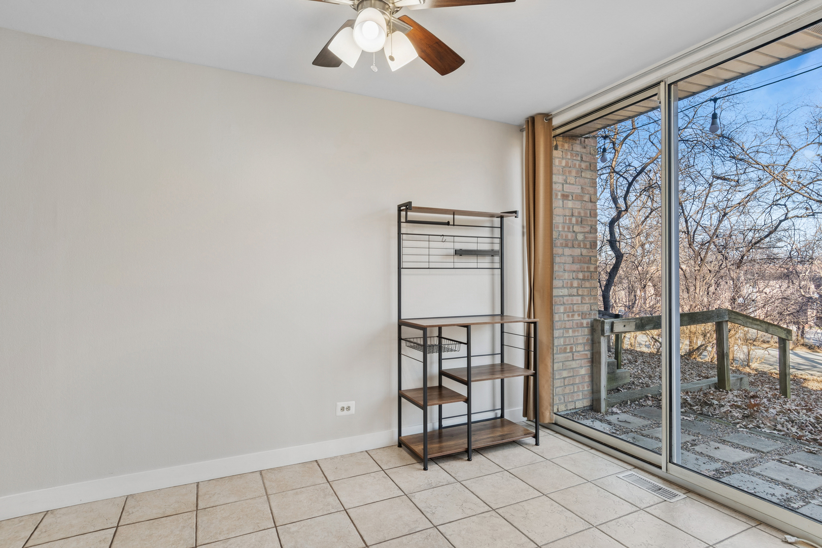 6012 Forest View Road, Unit 1D Lisle, IL 60532 - Photo 9 of 21 a view of an empty room with window