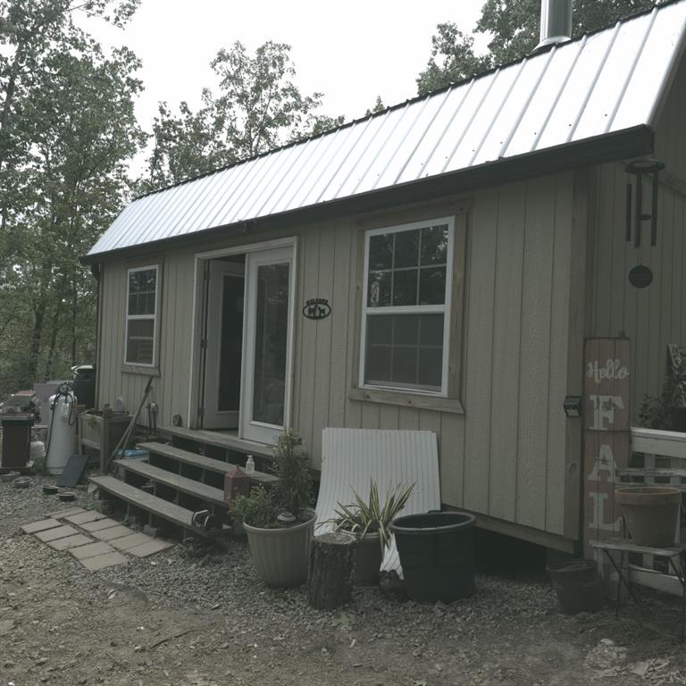 1251 Rambling Road Fairmount, GA 30139 - Photo 14 of 23 a backyard of a house with table and chairs
