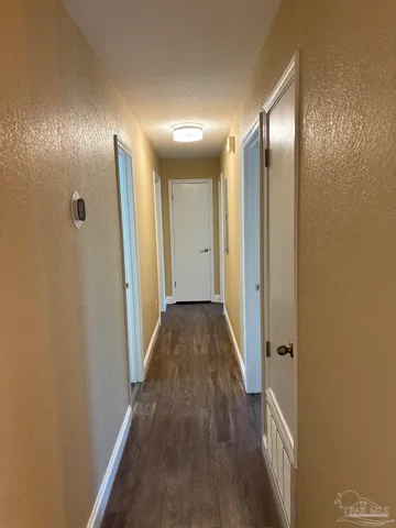 a view of hallway with livingroom