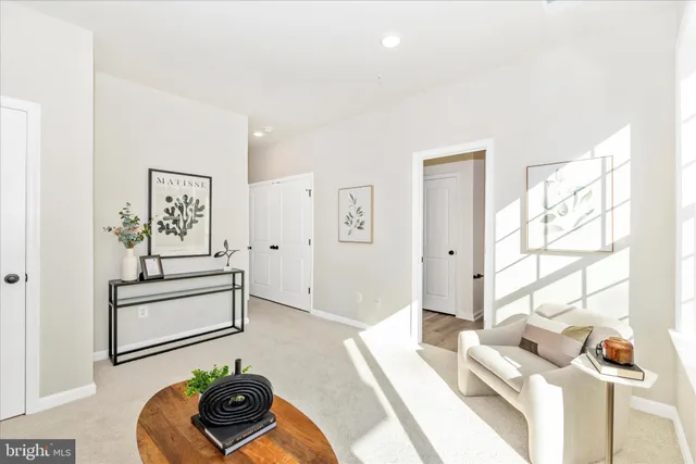 a living room with furniture and a painting