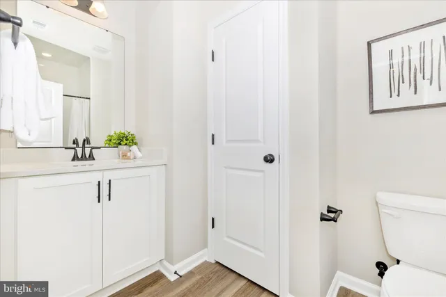 a bathroom with a sink and mirror