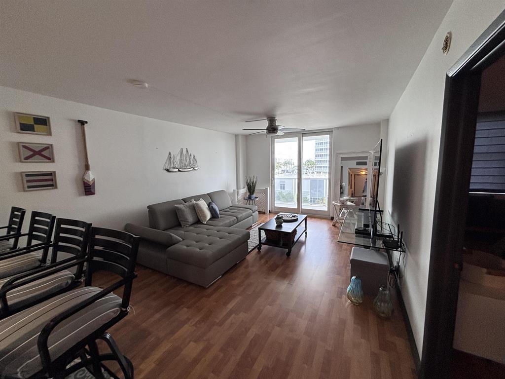 336 North Birch Road, Unit 8D Fort Lauderdale, FL 33304 - Photo 20 of 23 a living room with furniture and a wooden floor