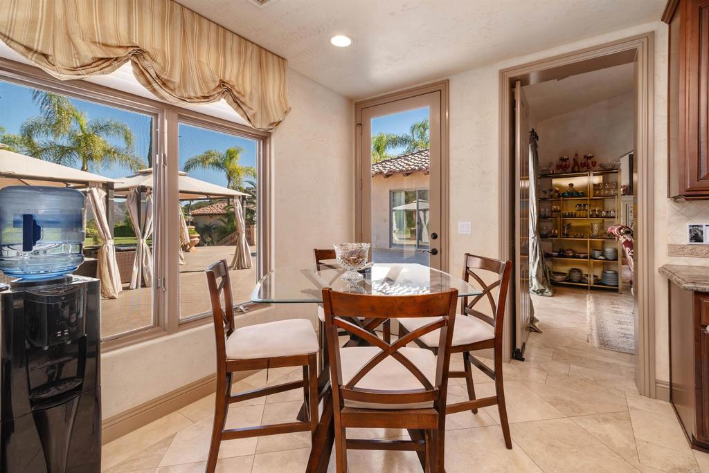 18545 Aliso Canyon Road Rancho Santa Fe, CA 92091 - Photo 20 of 48 a dining room with furniture and window