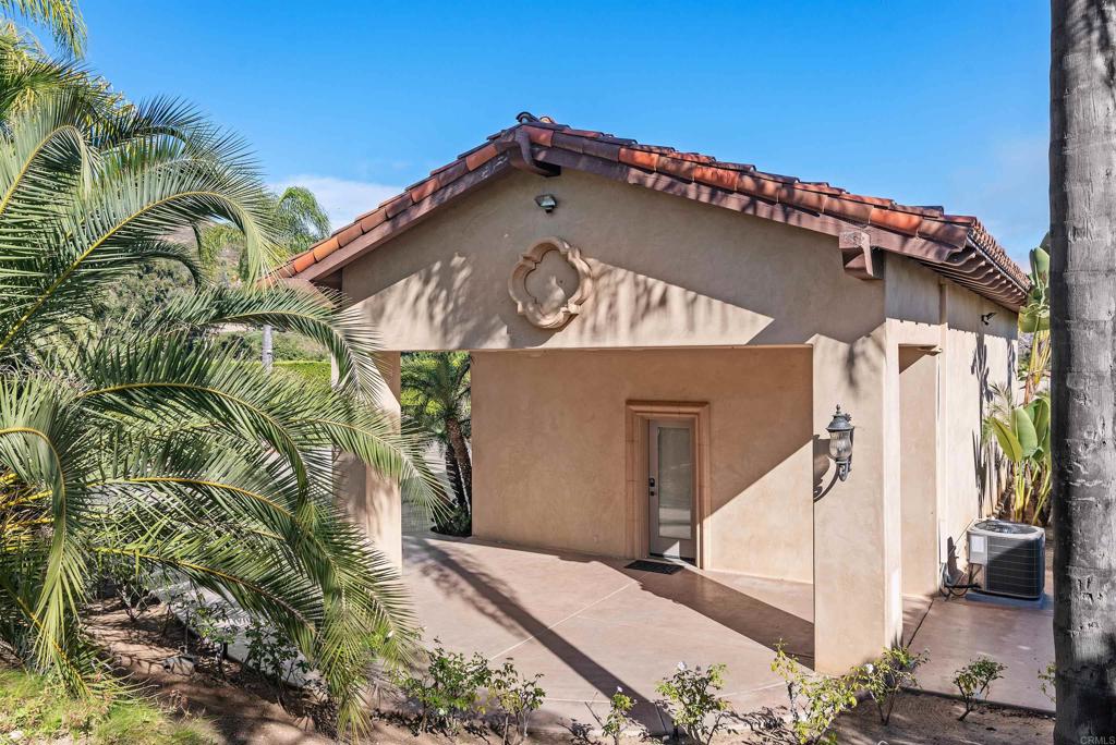 18545 Aliso Canyon Road Rancho Santa Fe, CA 92091 - Photo 39 of 48 a view of a house with a palm tree