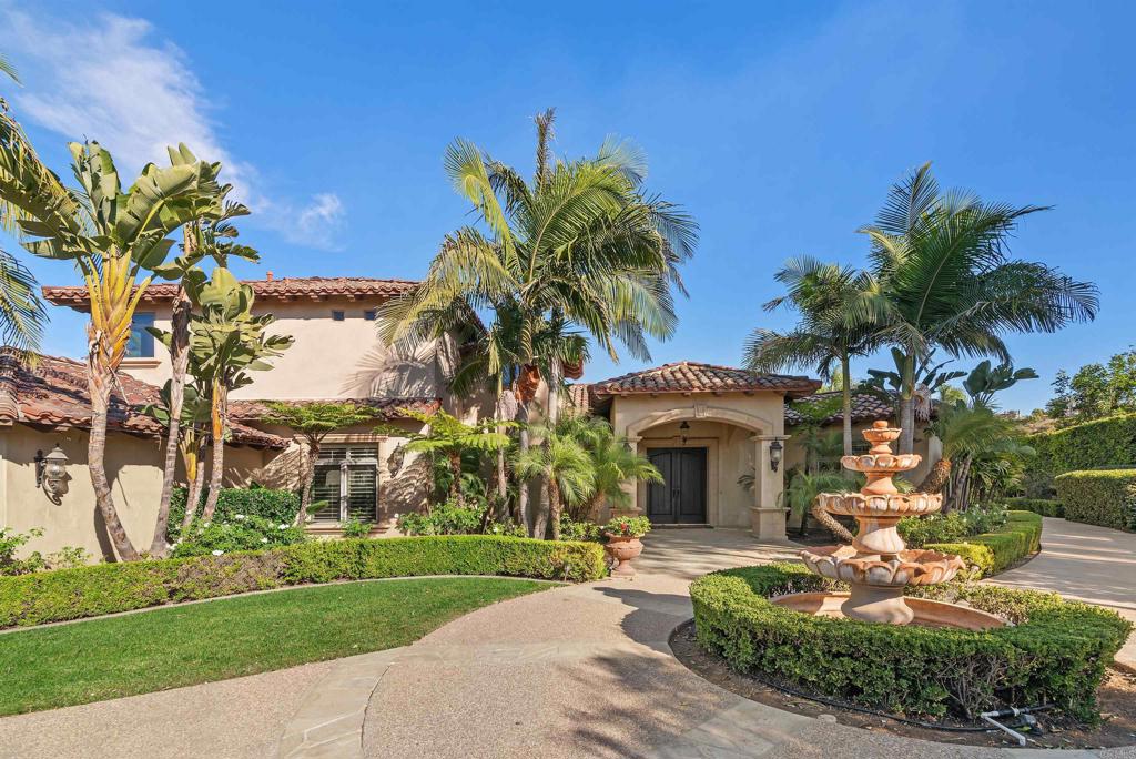 18545 Aliso Canyon Road Rancho Santa Fe, CA 92091 - Photo 4 of 48 a front view of a house with garden and trees