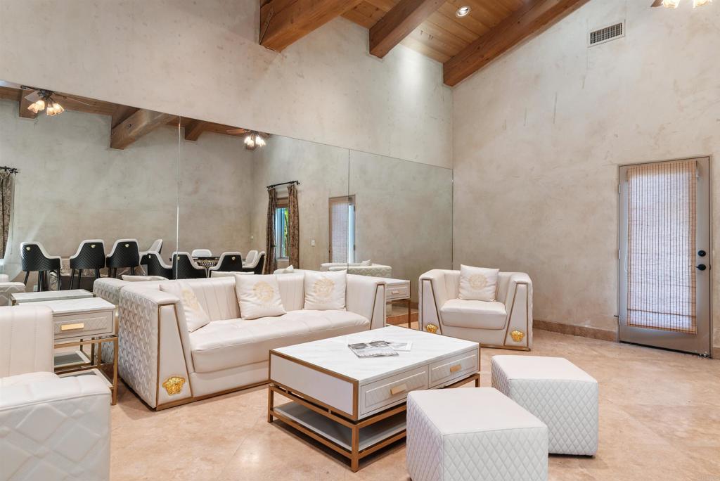 18545 Aliso Canyon Road Rancho Santa Fe, CA 92091 - Photo 41 of 48 a living room with furniture and a rug