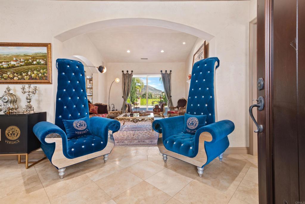 18545 Aliso Canyon Road Rancho Santa Fe, CA 92091 - Photo 5 of 48 a living room with furniture and a fireplace