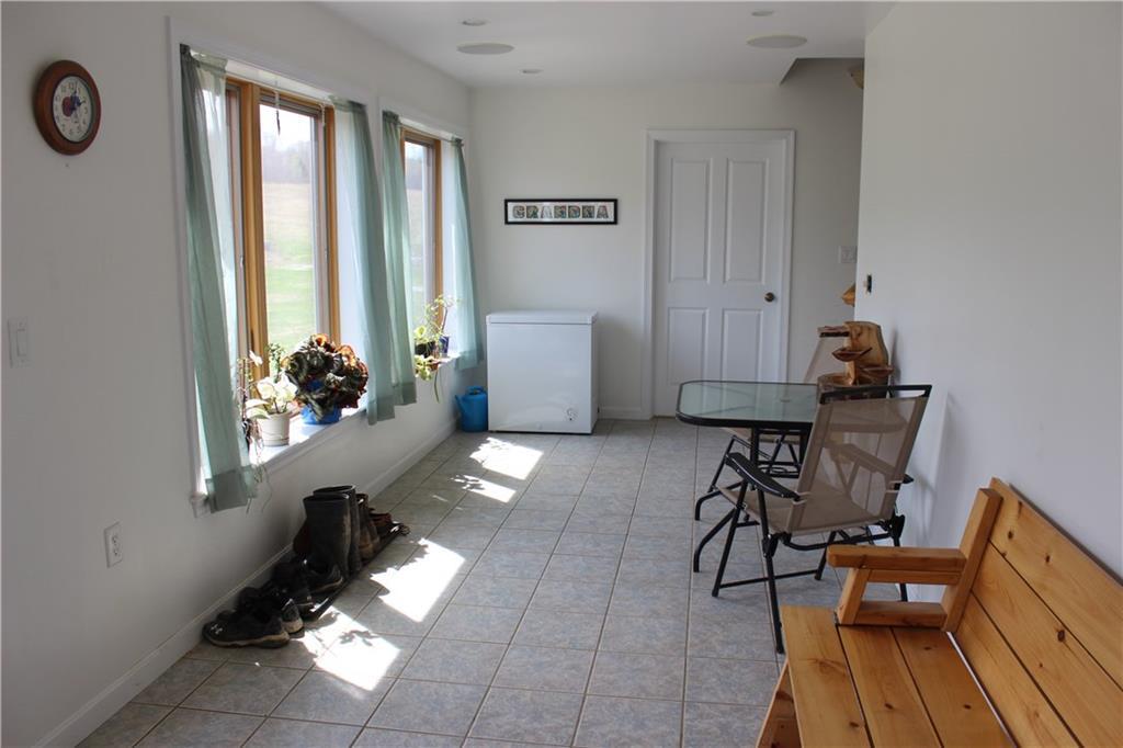 84 Kennard Road Newburgh, ME 04444 - Photo 19 of 35 Sun room area that also has an...