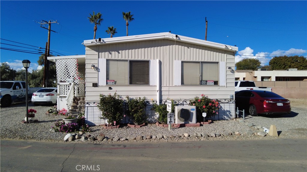 4561 Adobe Road, Unit 1 Twentynine Palms, CA 92277 - Photo 1 of 57 a front view of a house with a patio
