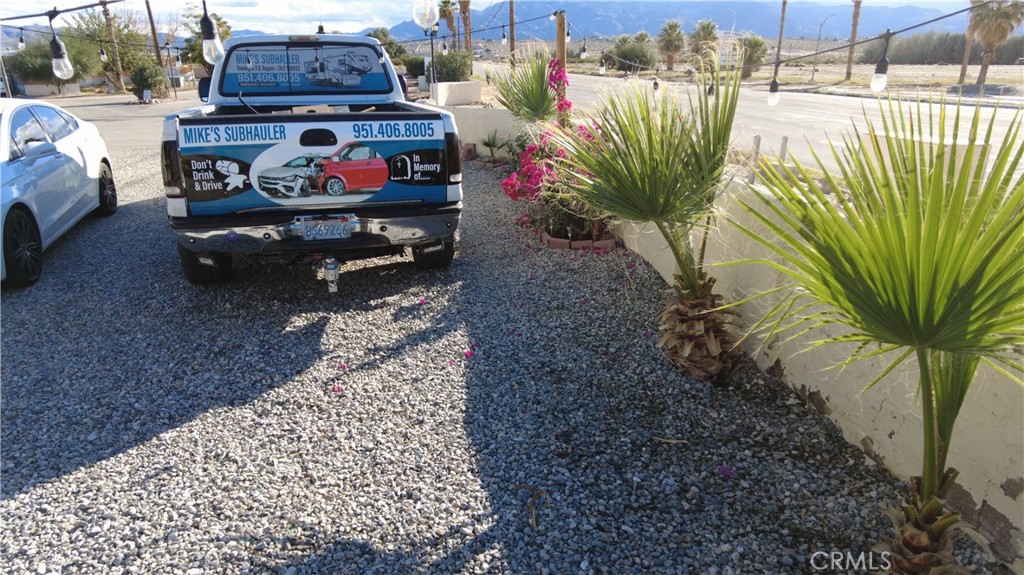 4561 Adobe Road, Unit 1 Twentynine Palms, CA 92277 - Photo 13 of 57 a reading room with furniture and a garden
