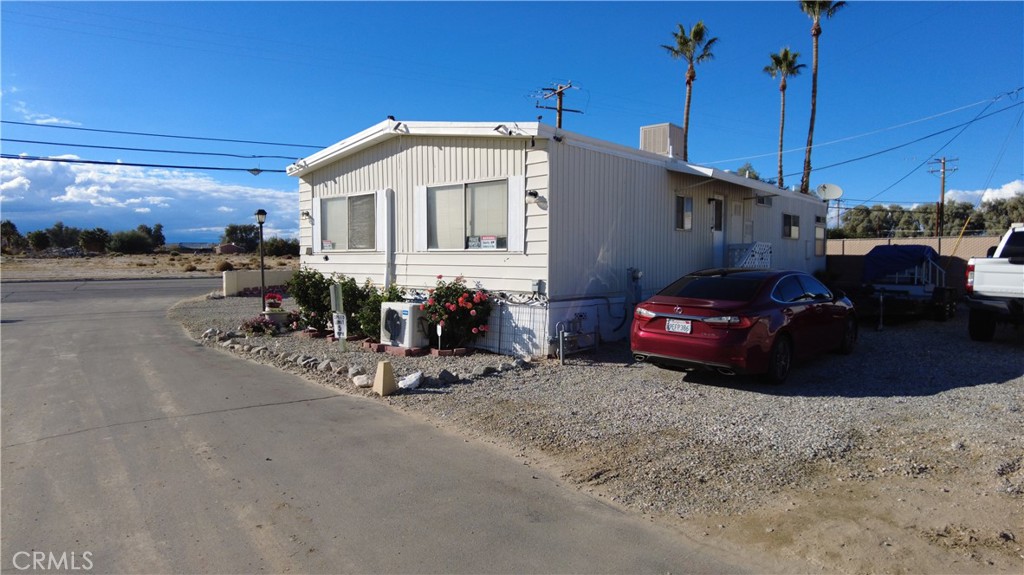 4561 Adobe Road, Unit 1 Twentynine Palms, CA 92277 - Photo 3 of 57 a view of a car park in front of house