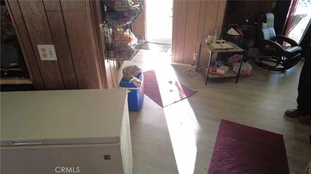 a bedroom with bed and a mirror