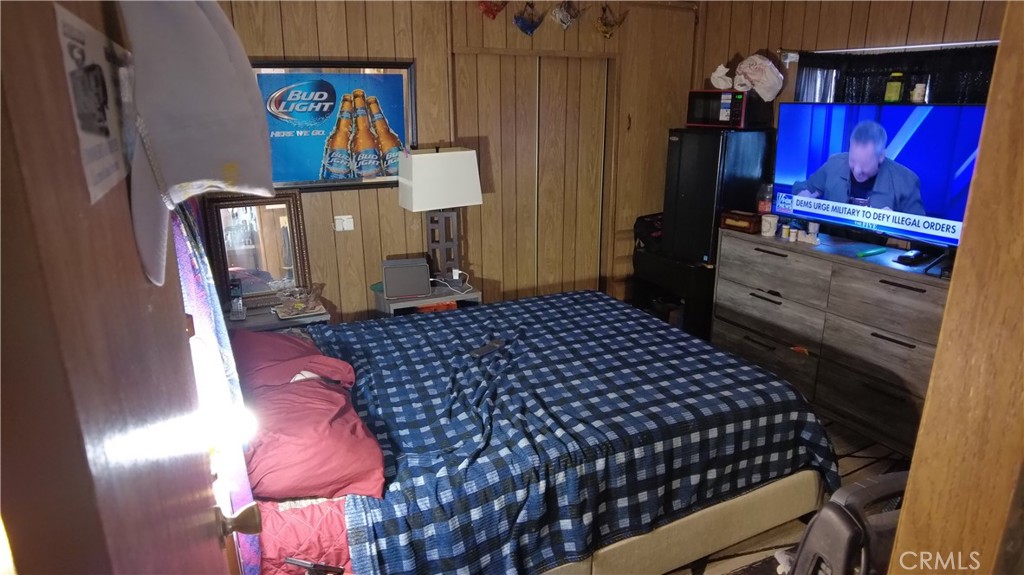 4561 Adobe Road, Unit 1 Twentynine Palms, CA 92277 - Photo 36 of 57 a bed room with a bed and a window