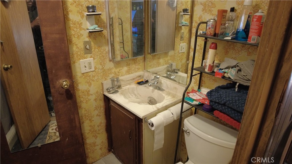 4561 Adobe Road, Unit 1 Twentynine Palms, CA 92277 - Photo 38 of 57 a bathroom with a sink and mirror