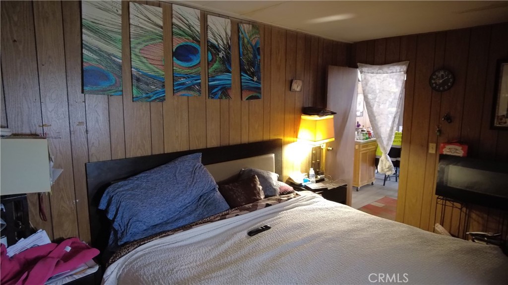 4561 Adobe Road, Unit 1 Twentynine Palms, CA 92277 - Photo 43 of 57 a bedroom with a bed and a closet