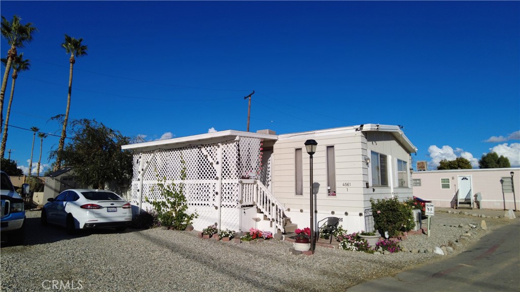 4561 Adobe Road, Unit 1 Twentynine Palms, CA 92277 - Photo 57 of 57 a front view of a house with a yard