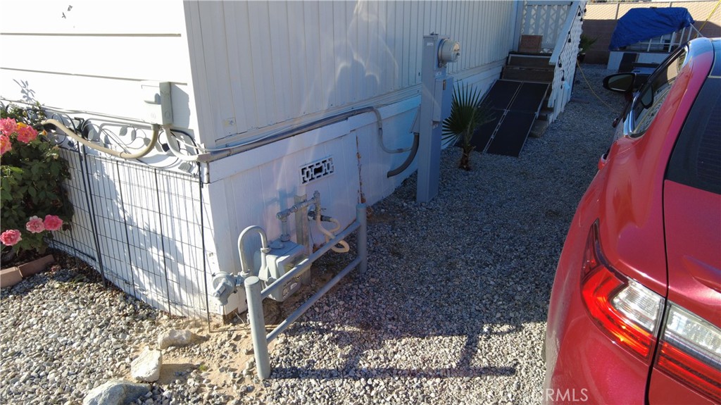 4561 Adobe Road, Unit 1 Twentynine Palms, CA 92277 - Photo 6 of 57 a view of an entryway with a lot of flower plants