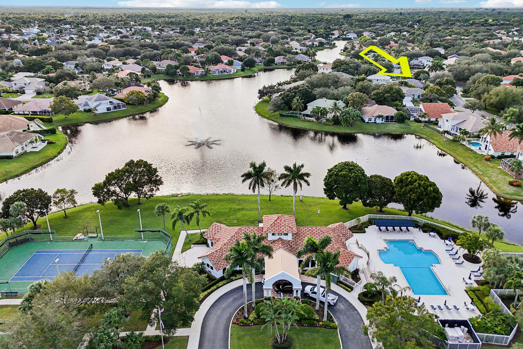 an aerial view of a house with outdoor space