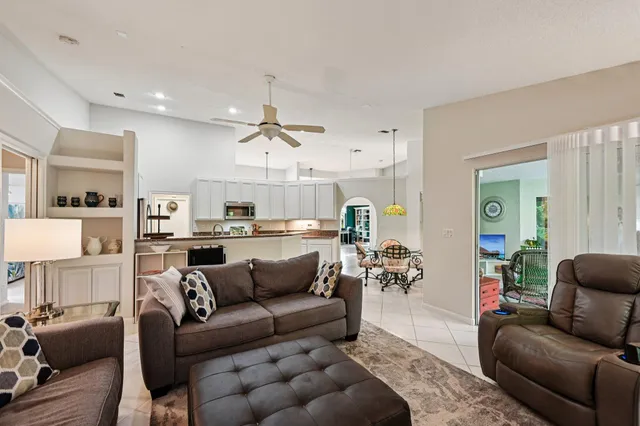 a kitchen with stainless steel appliances a sink stove and cabinets
