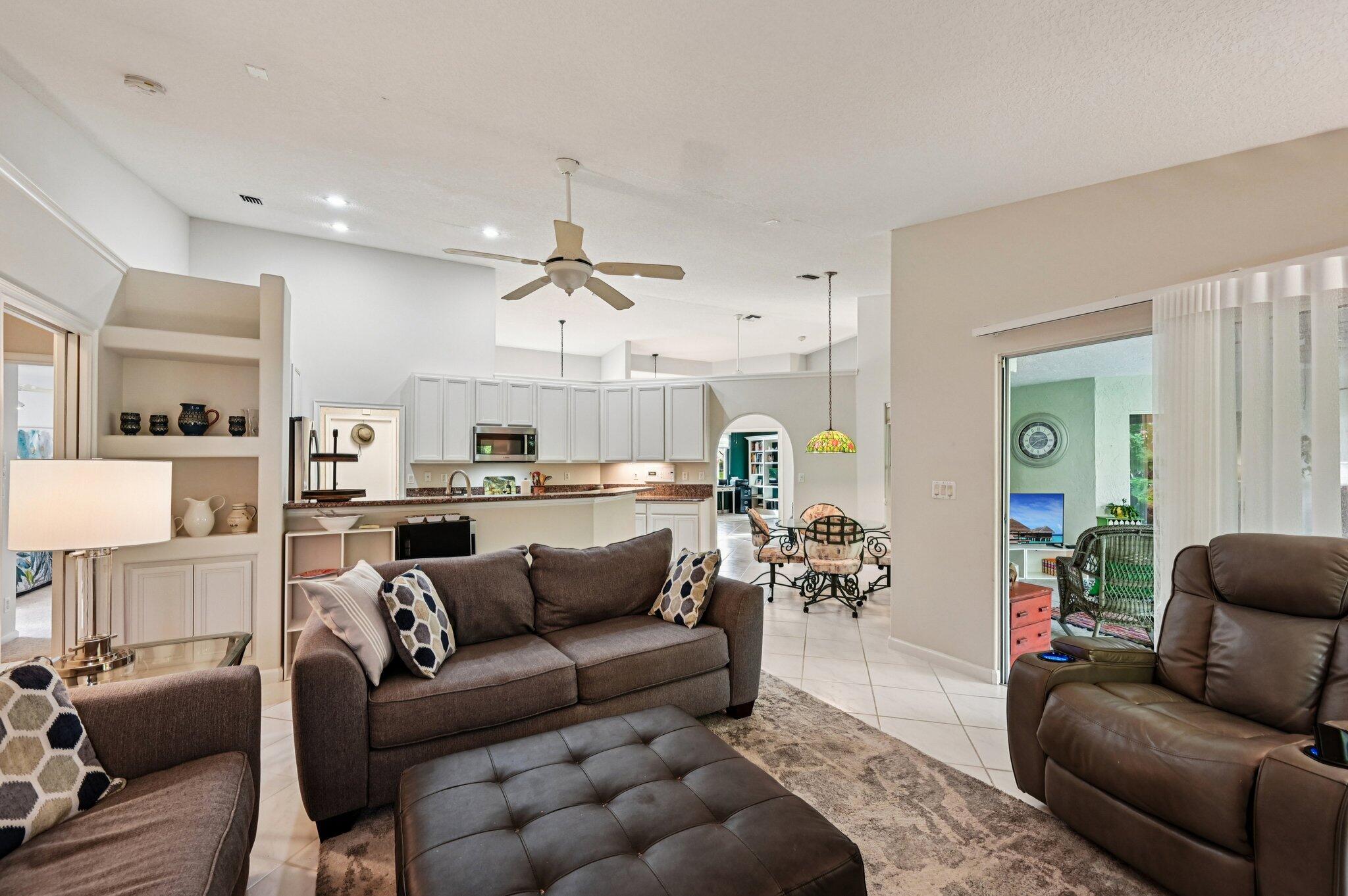 231 Sparrow Point Jupiter, FL 33458 - Photo 11 of 65 a living room with furniture and kitchen view