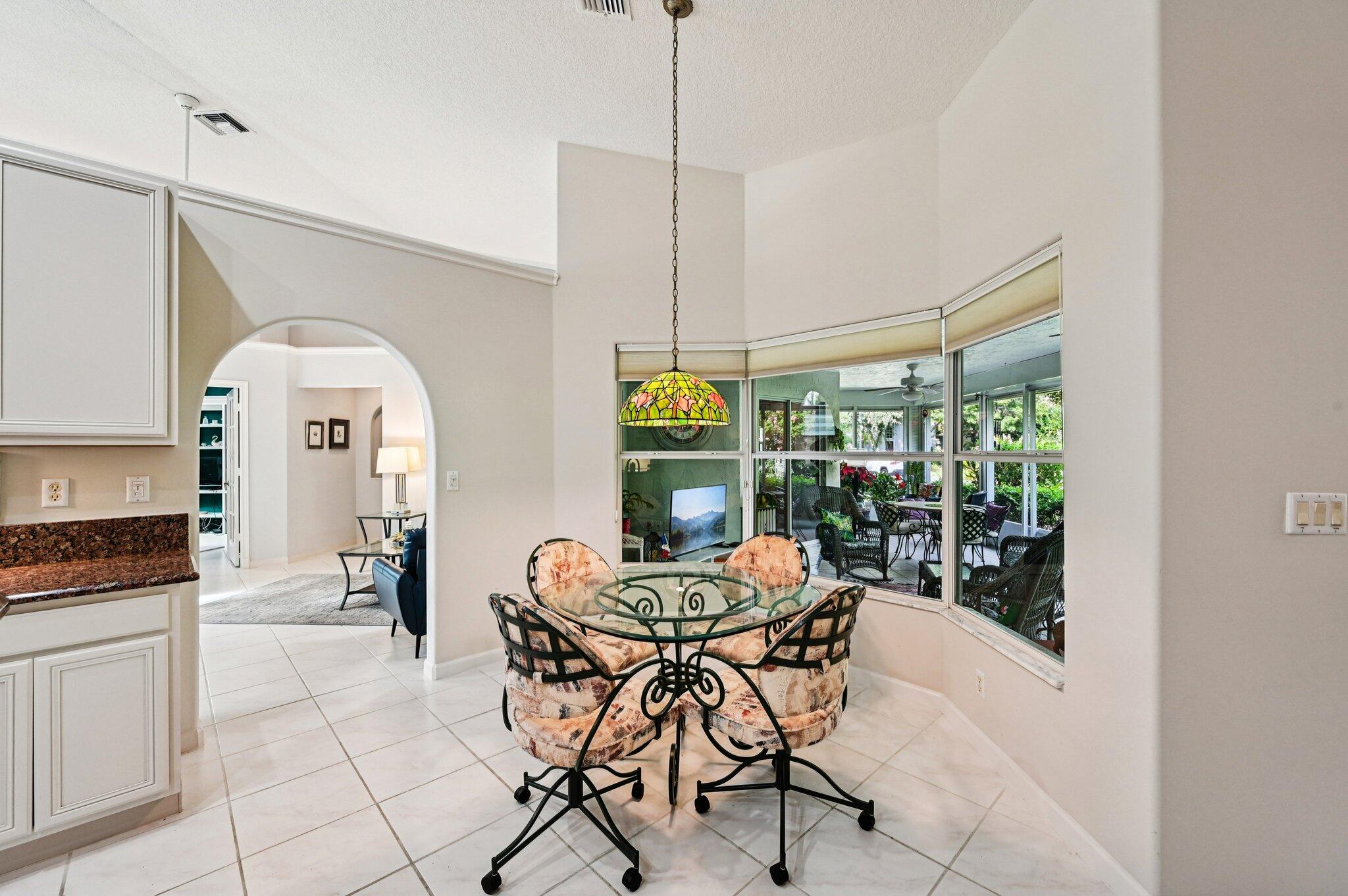 231 Sparrow Point Jupiter, FL 33458 - Photo 12 of 65 a view of a dining room with furniture window and outside view