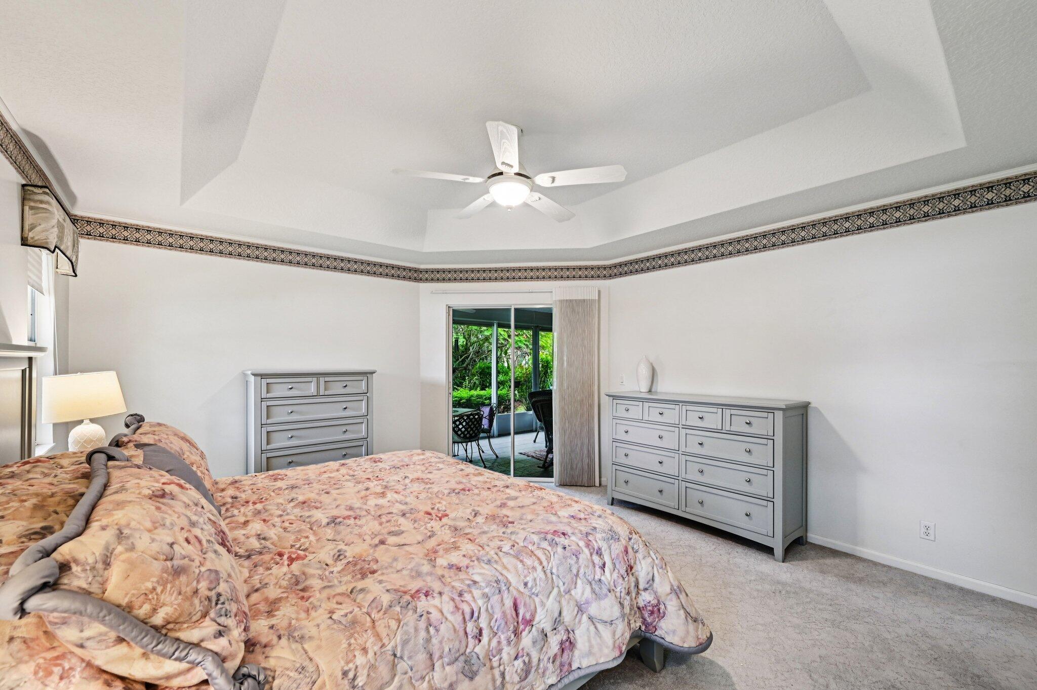 231 Sparrow Point Jupiter, FL 33458 - Photo 24 of 65 a bedroom with a bed dresser and a window