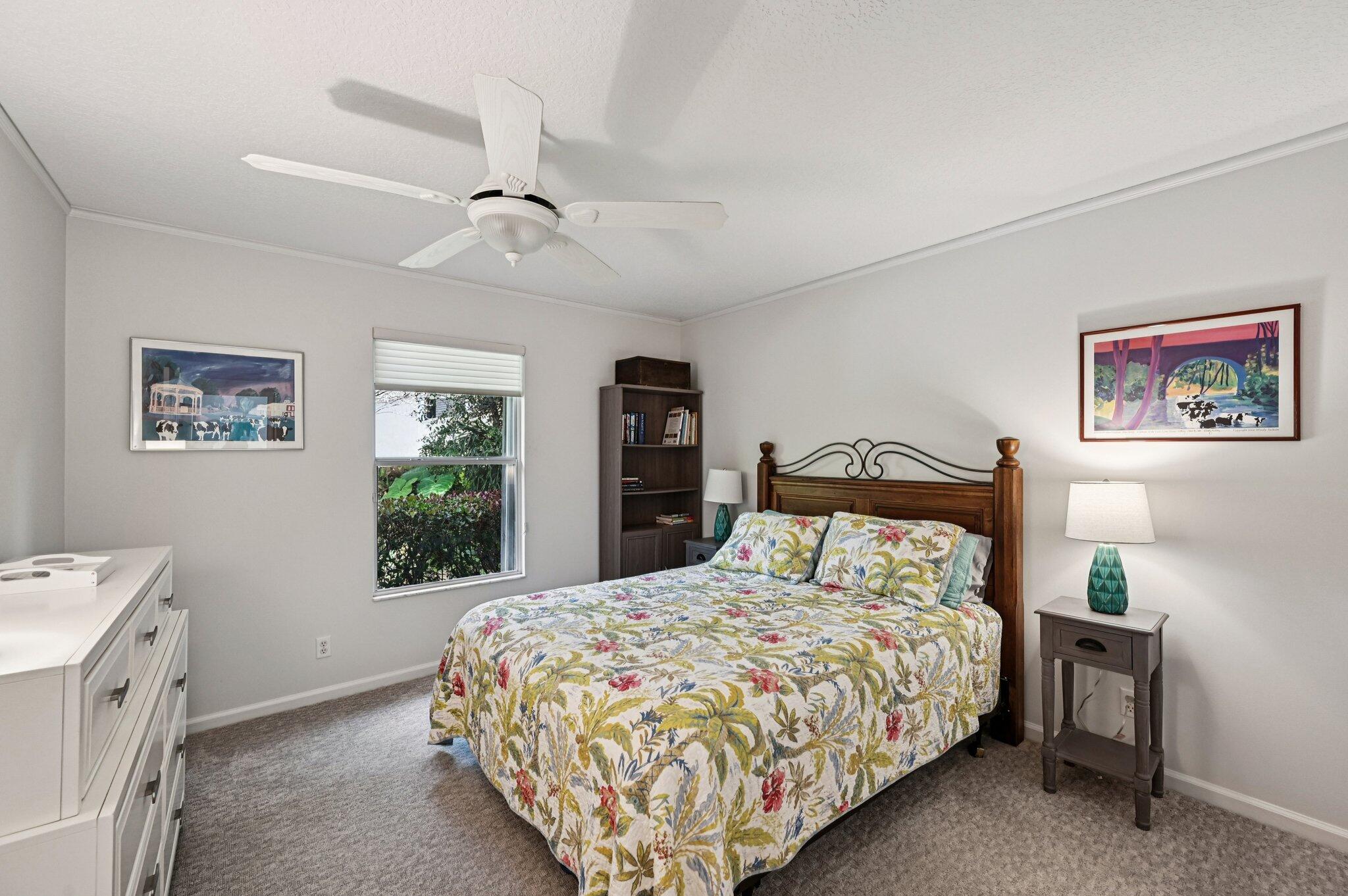 231 Sparrow Point Jupiter, FL 33458 - Photo 31 of 65 a bedroom with a large bed and a window