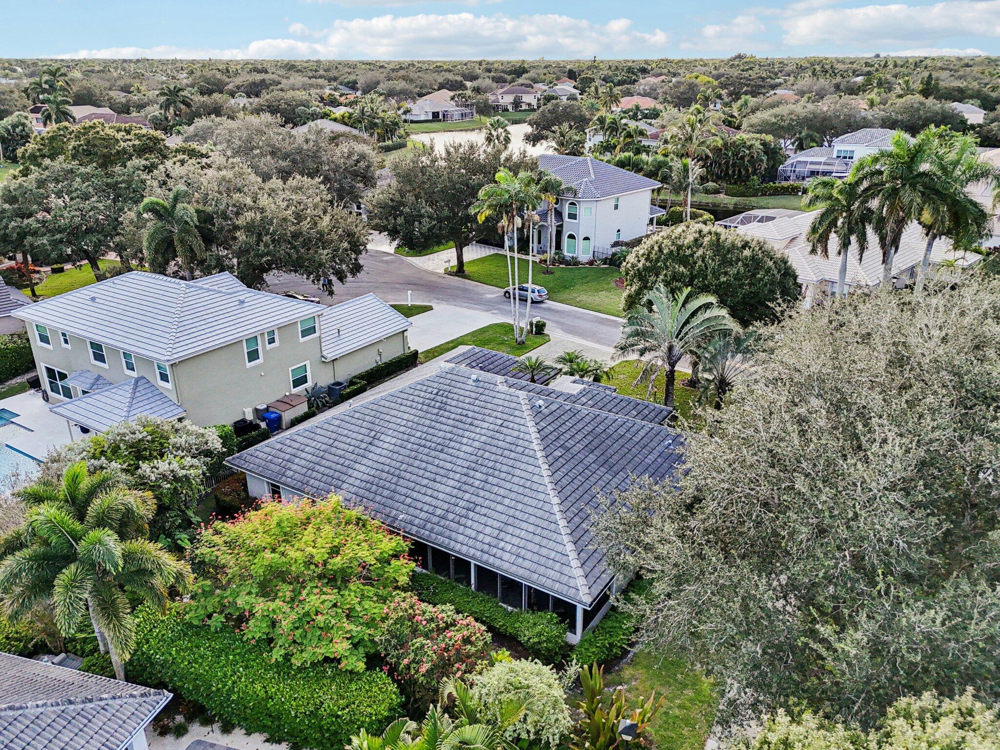 231 Sparrow Point Jupiter, FL 33458 - Photo 39 of 65 an aerial view of a house with a yard
