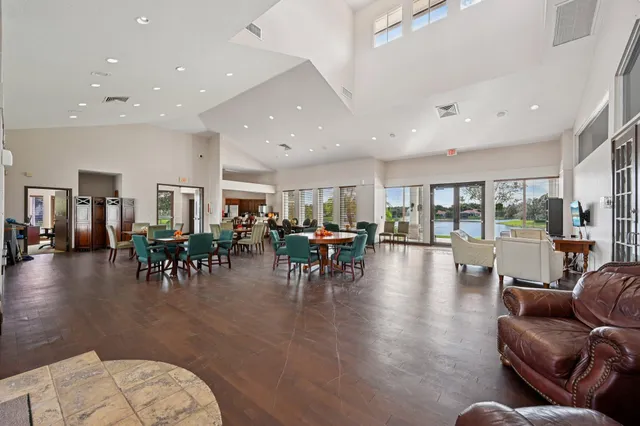 a view of a field with an trees in the background