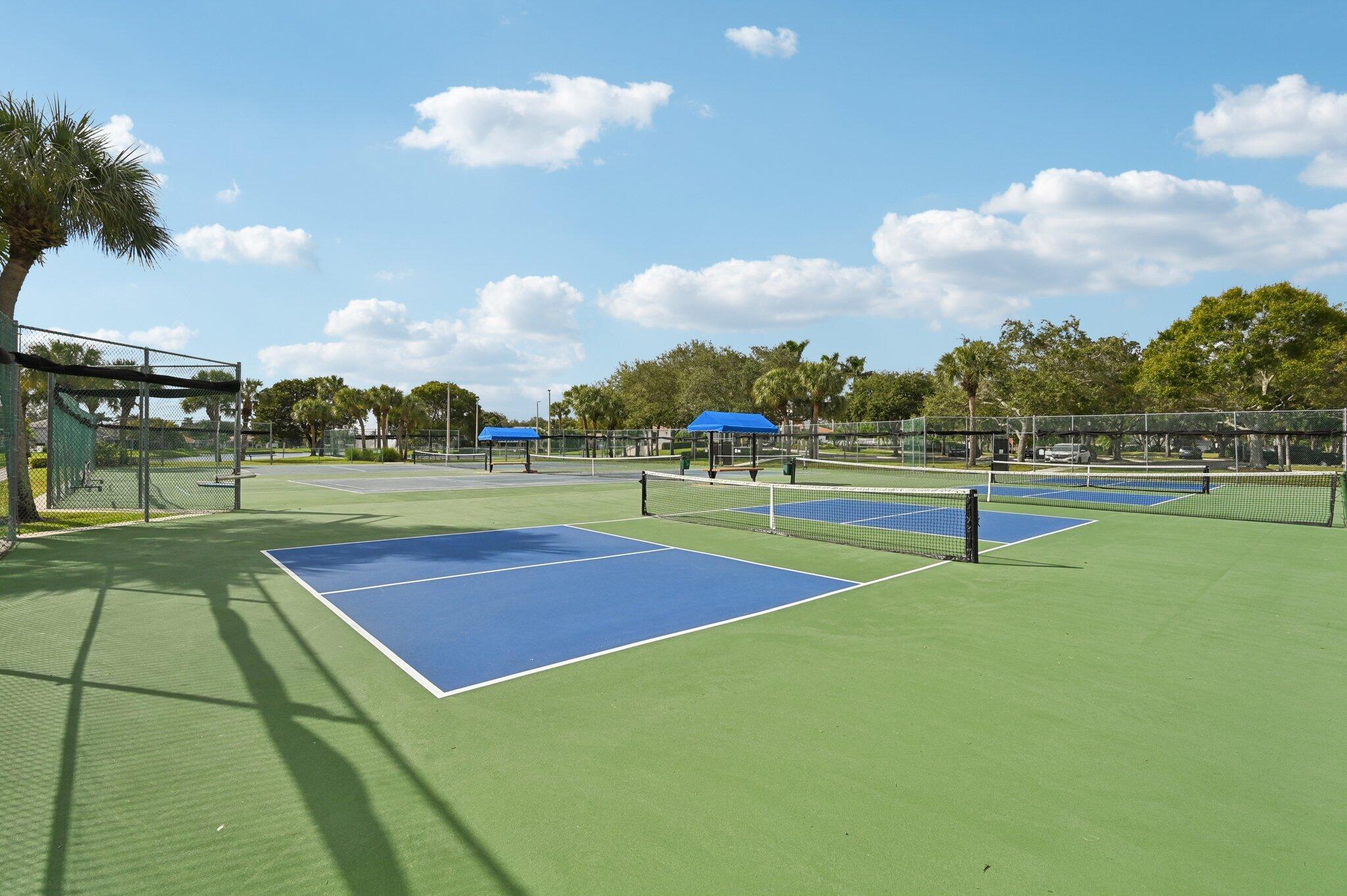 231 Sparrow Point Jupiter, FL 33458 - Photo 57 of 65 a view of an outdoor space and tennis court
