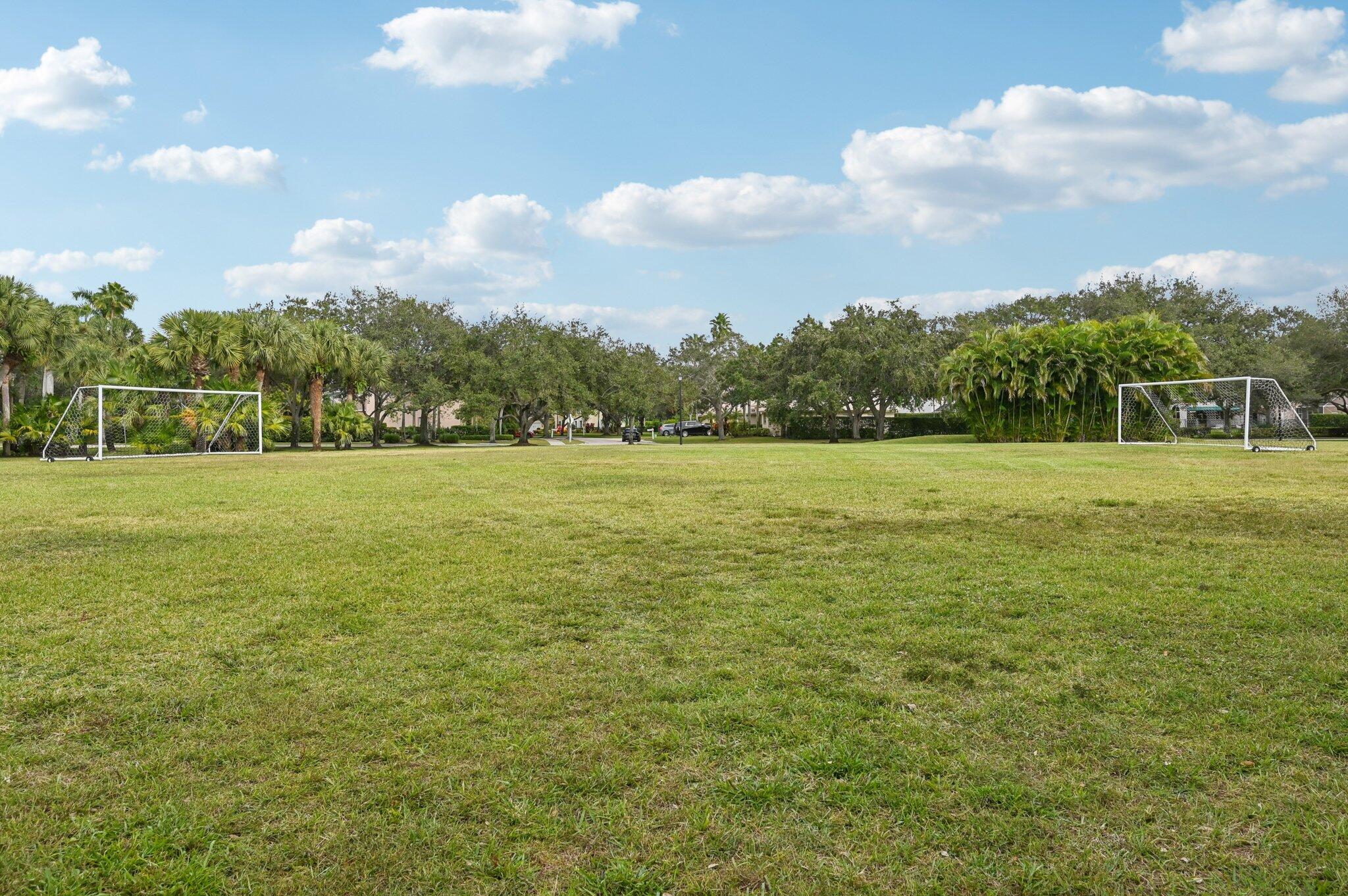 231 Sparrow Point Jupiter, FL 33458 - Photo 63 of 65 a view of a field with an trees in the background