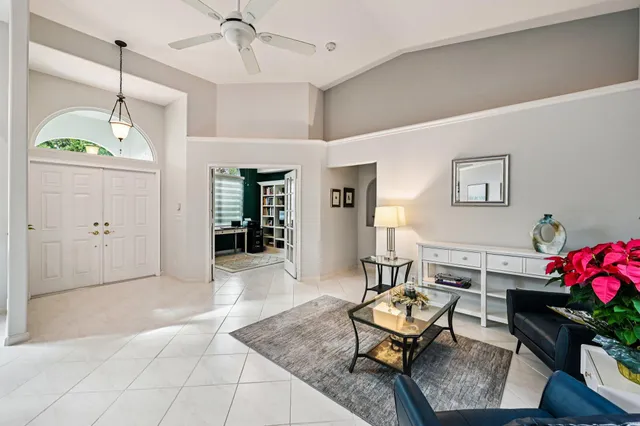 a kitchen with stainless steel appliances kitchen island granite countertop a table and chairs in it