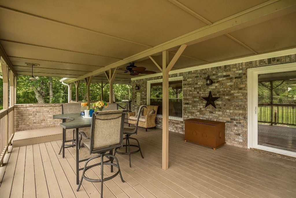 8114 Ridgewood Road Goodlettsville, TN 37072 - Photo 23 of 30 The covered deck has plenty of room to entertain.