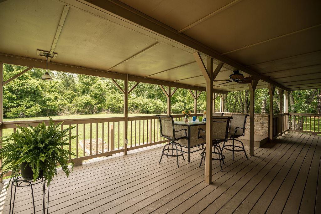 8114 Ridgewood Road Goodlettsville, TN 37072 - Photo 24 of 30 The covered deck looks out over the wooded back yard.