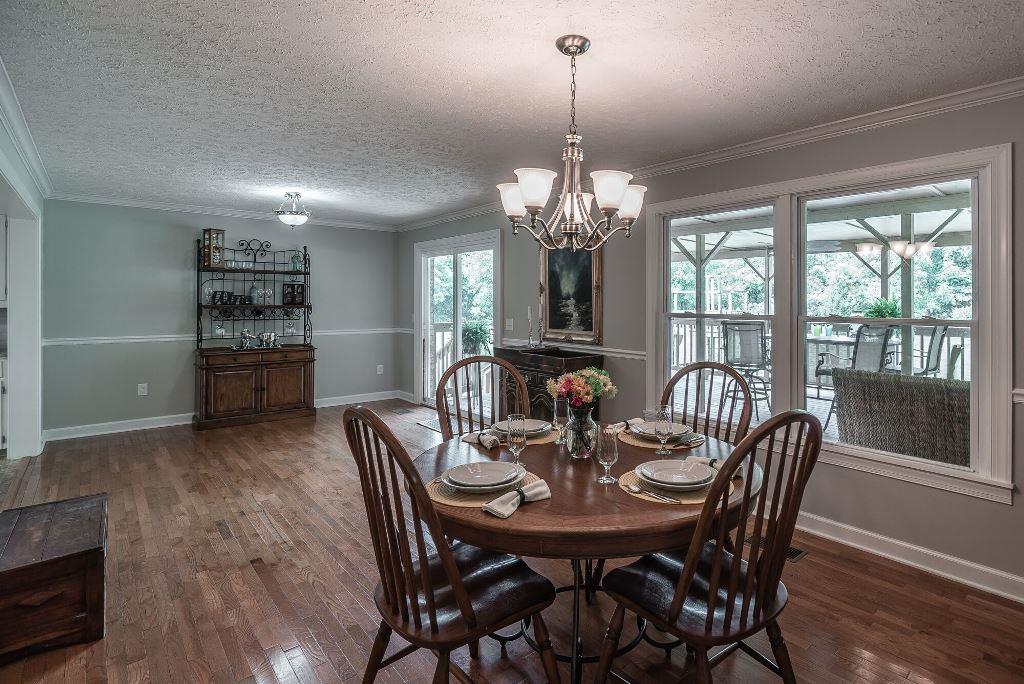 8114 Ridgewood Road Goodlettsville, TN 37072 - Photo 9 of 30 Separate dining room with hardwood floors and sliding doors that lead to the covered deck.