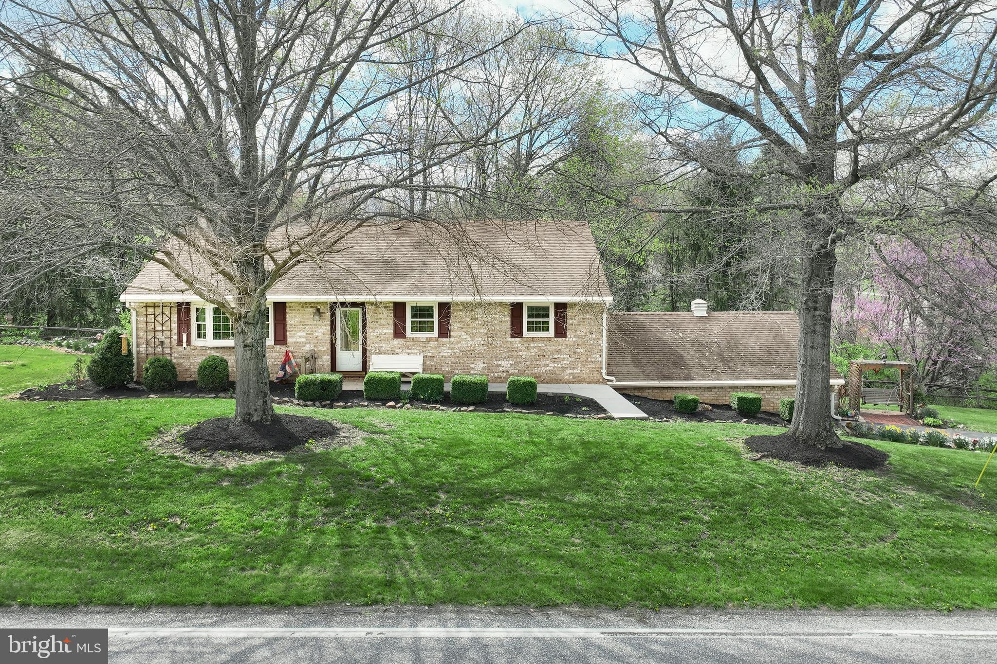 4999 Lehman Road Spring Grove, PA 17362 - Photo 1 of 32 a front view of house with yard and green space