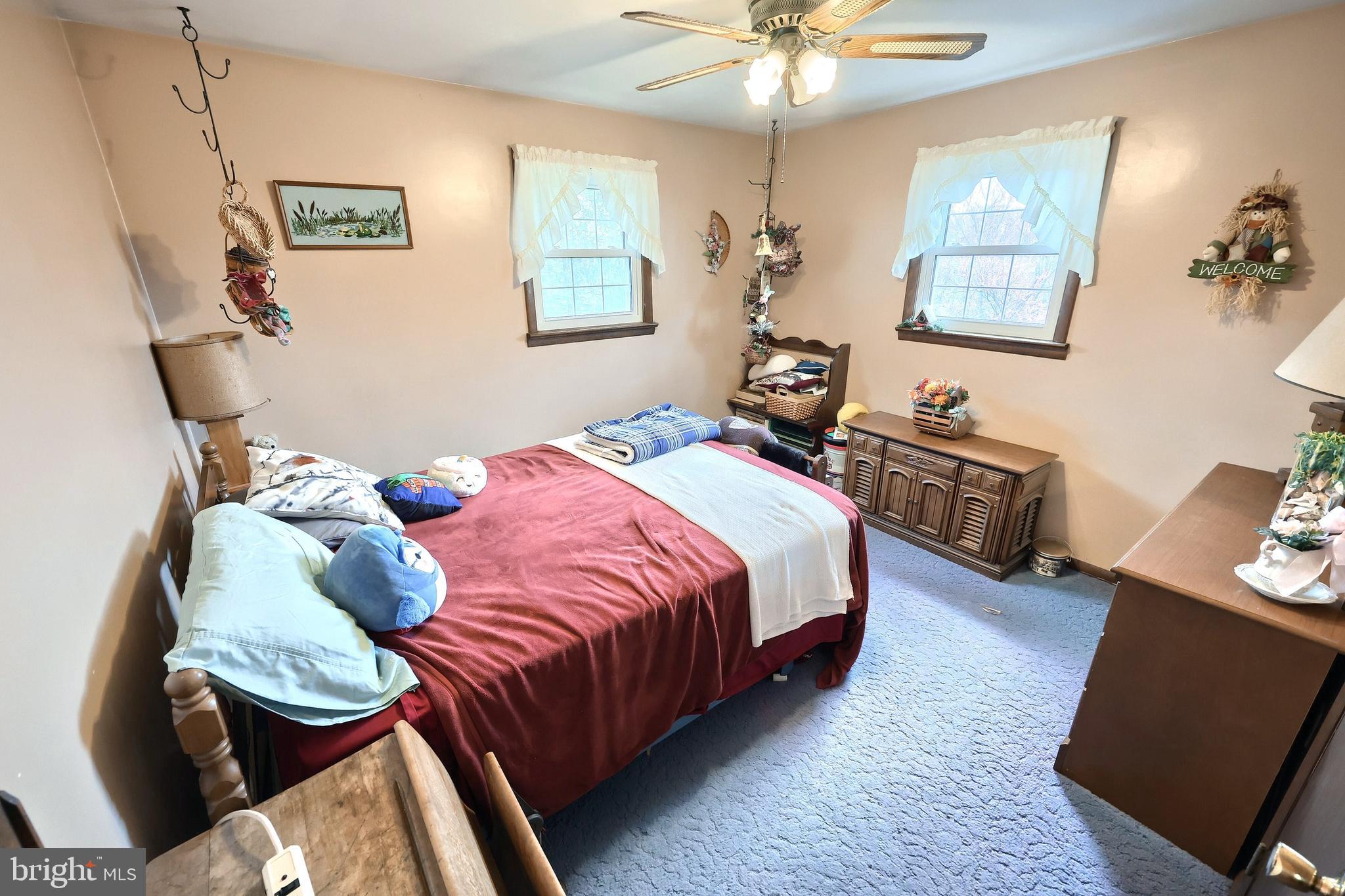 4999 Lehman Road Spring Grove, PA 17362 - Photo 21 of 32 a bedroom with a bed and wooden floor