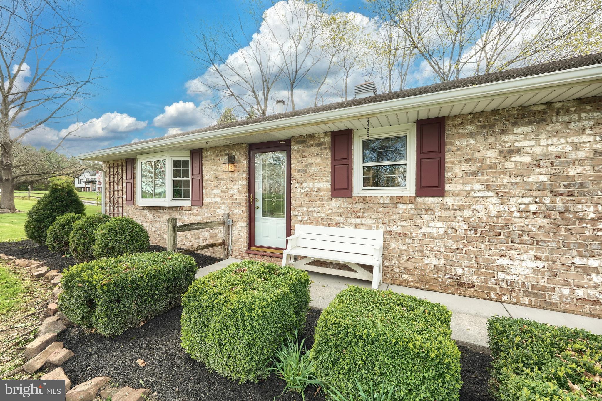 4999 Lehman Road Spring Grove, PA 17362 - Photo 4 of 32 a front view of a house with garden