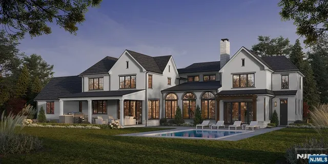 a front view of a house with a yard table and chairs