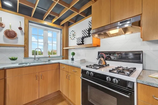 a kitchen with a stove and a sink