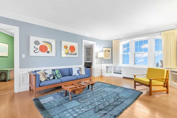 a living room with furniture and a rug