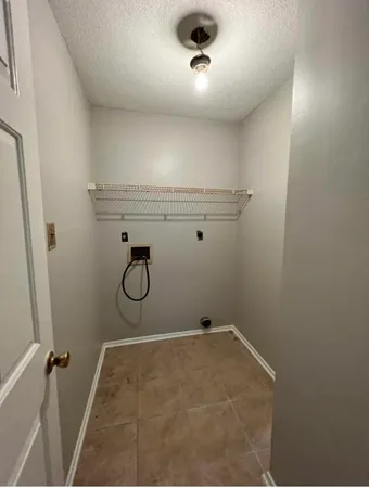 view of a room with rack on the wall