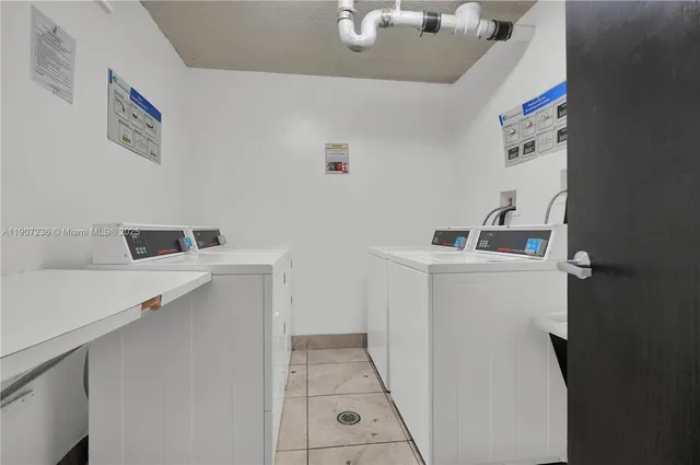 a living room with furniture and a book shelf