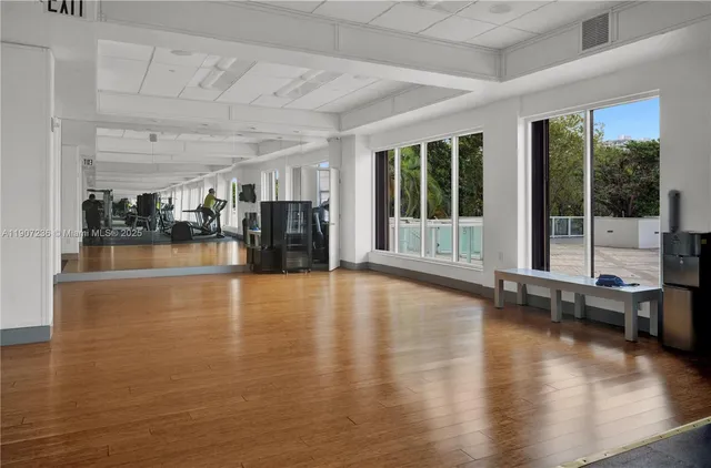 a view of a swimming pool with outdoor seating