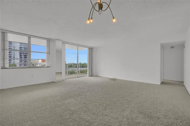 a view of a bathroom with a glass door and shower