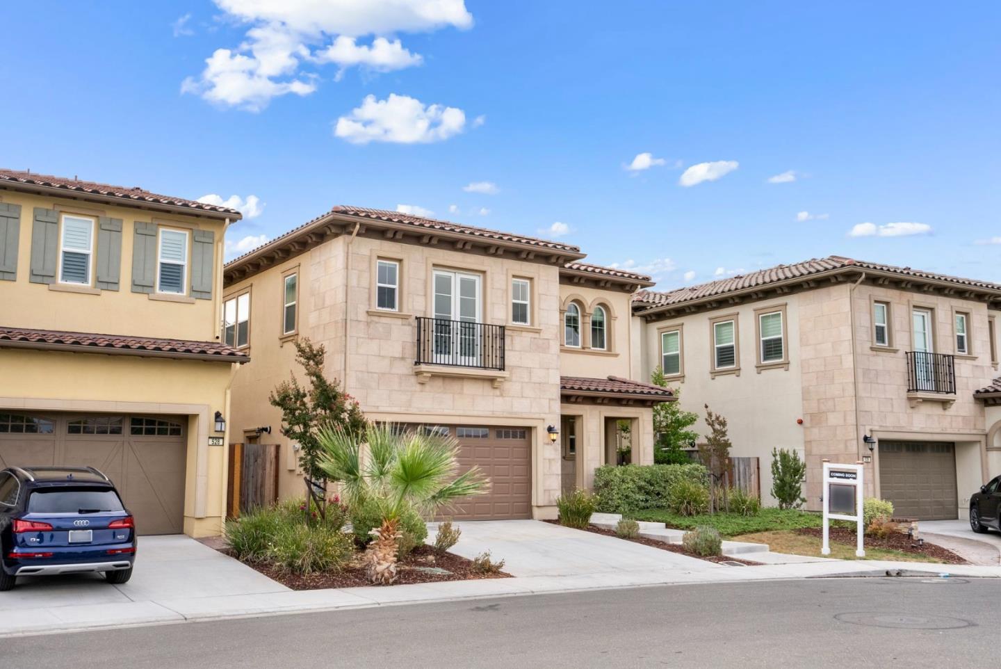 a car parked in front of white house