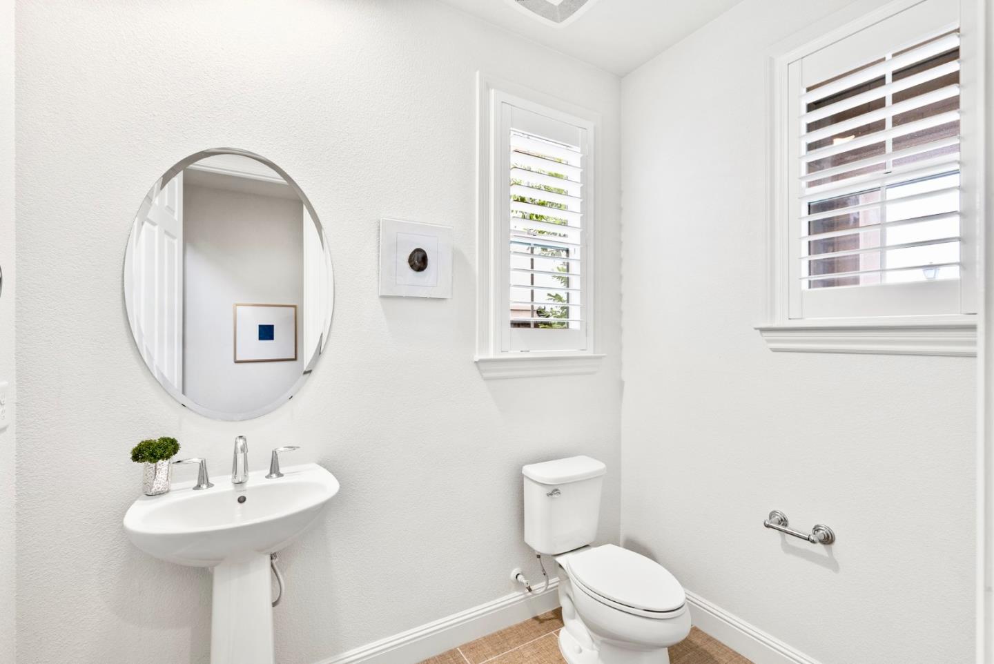 532 Hyacinthus Court San Ramon, CA 94582 - Photo 24 of 31 a bathroom with a toilet a sink and a mirror